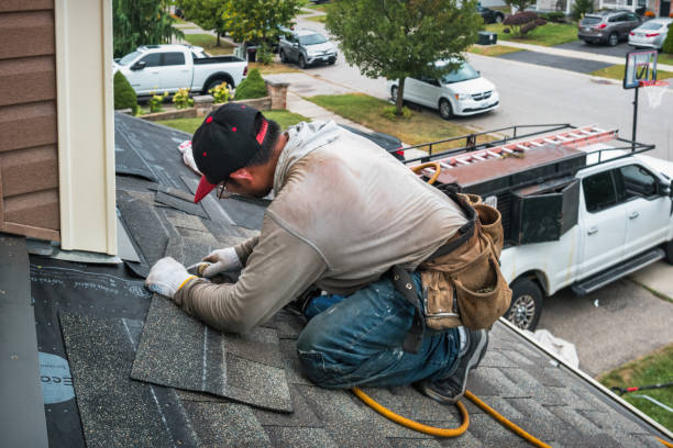 Professional Roofing technician working in Linwood, MA